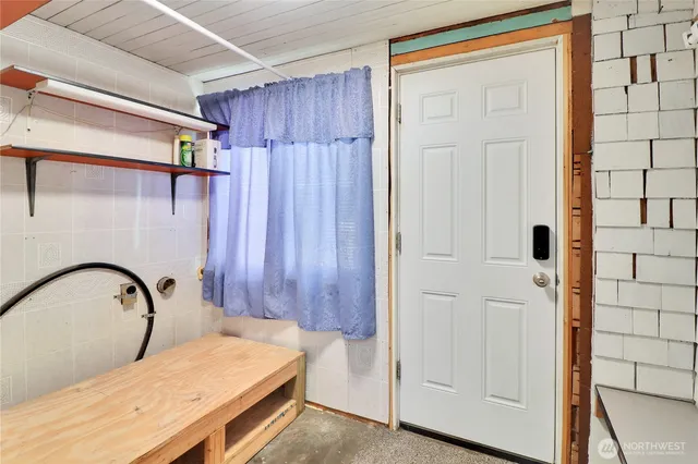 a view of a house with a yard and wooden fence
