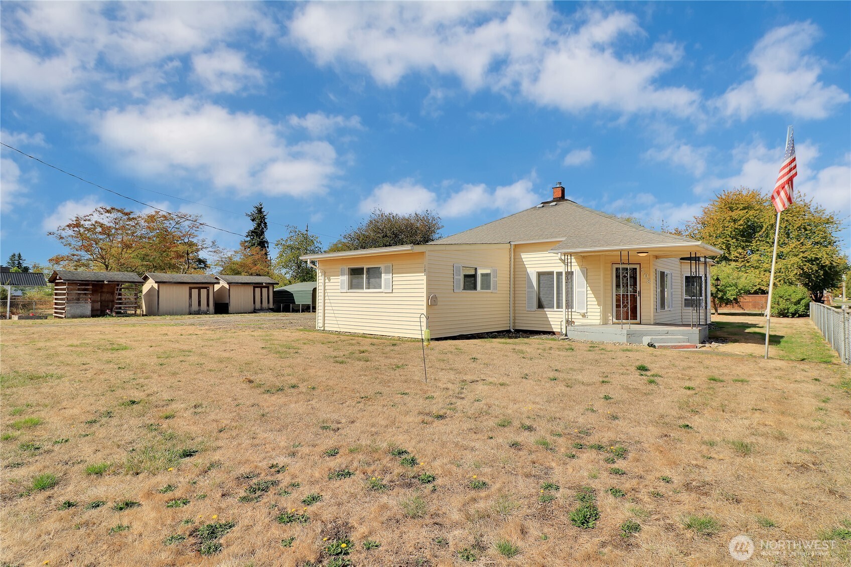 108 2nd Street Southeast Rainier, WA 98576 - Photo 33 of 40 a front view of a house with a yard and garage