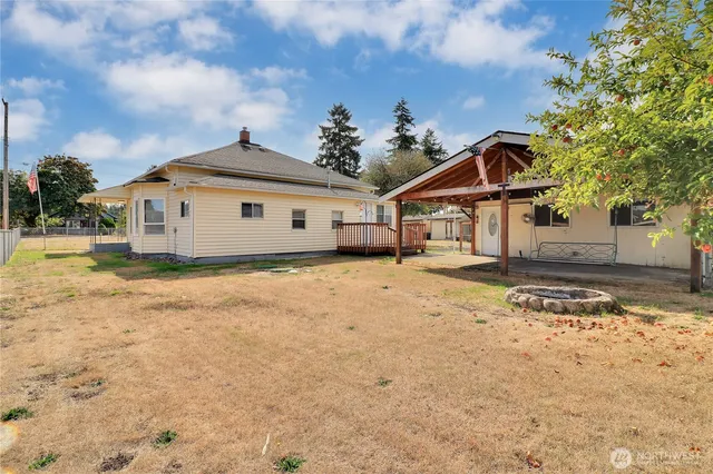 a view of house with yard and front view of house