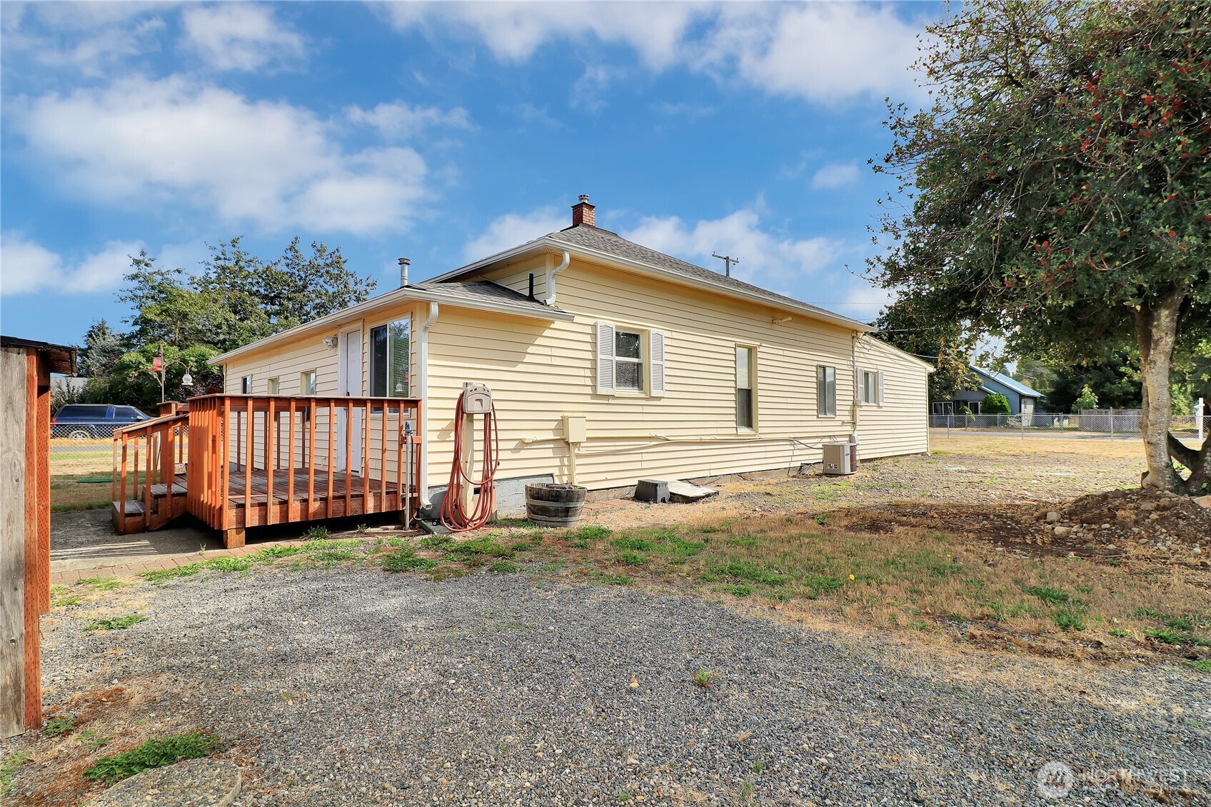 108 2nd Street Southeast Rainier, WA 98576 - Photo 35 of 40 a view of a house with a yard and fence
