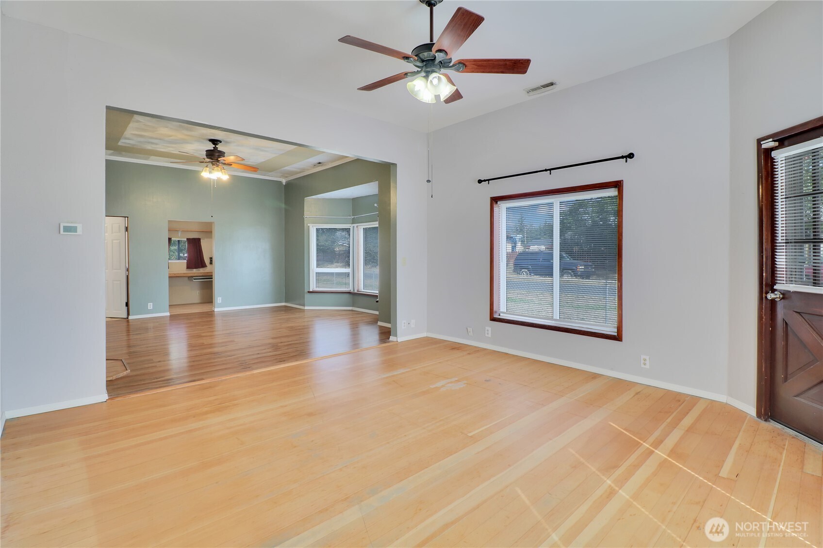 108 2nd Street Southeast Rainier, WA 98576 - Photo 5 of 40 a view of an empty room with window and a kitchen