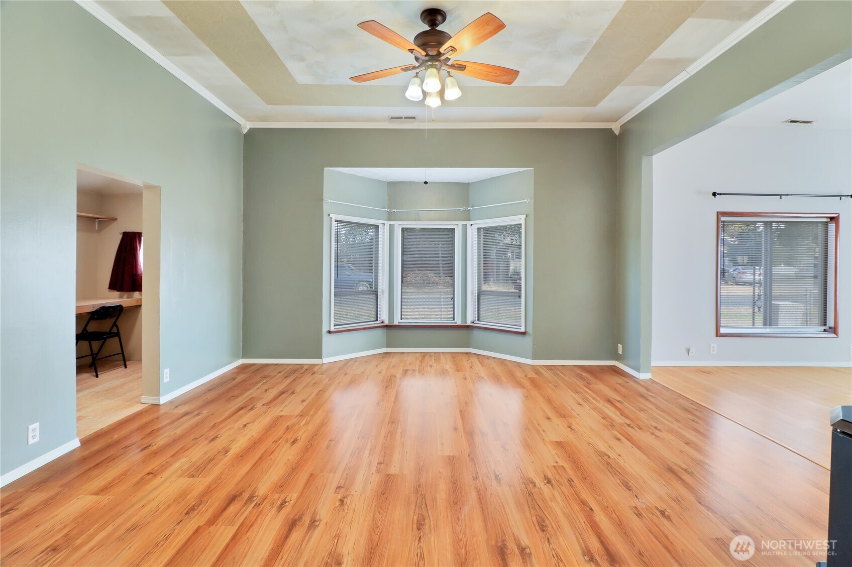 108 2nd Street Southeast Rainier, WA 98576 - Photo 8 of 40 a bedroom with a large bed and a chandelier fan