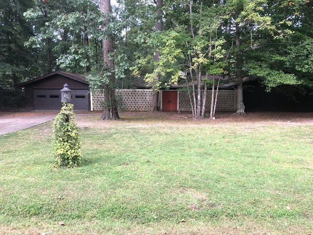 3307 Timberlake Road Raleigh, NC 27604 - Photo 21 of 21 a backyard of a house with lots of green space