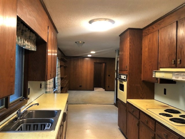 3307 Timberlake Road Raleigh, NC 27604 - Photo 4 of 21 a large kitchen with stainless steel appliances a stove a sink and a refrigerator