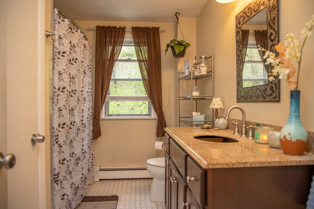 75 Sagamore Road West Springfield, MA 01089 - Photo 18 of 24 a bathroom with a granite countertop sink a mirror and shower