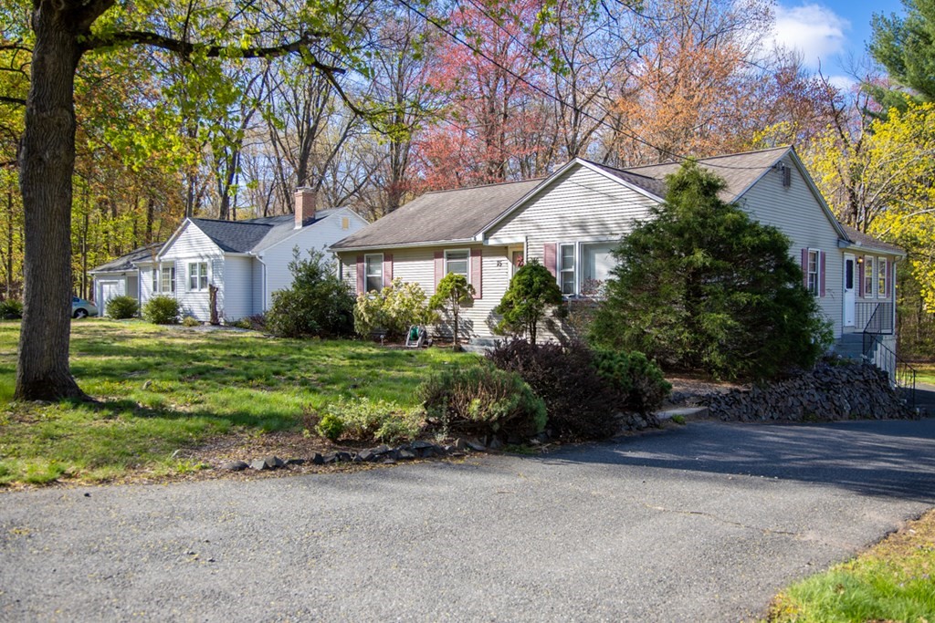 75 Sagamore Road West Springfield, MA 01089 - Photo 3 of 24 a front view of a house with garden