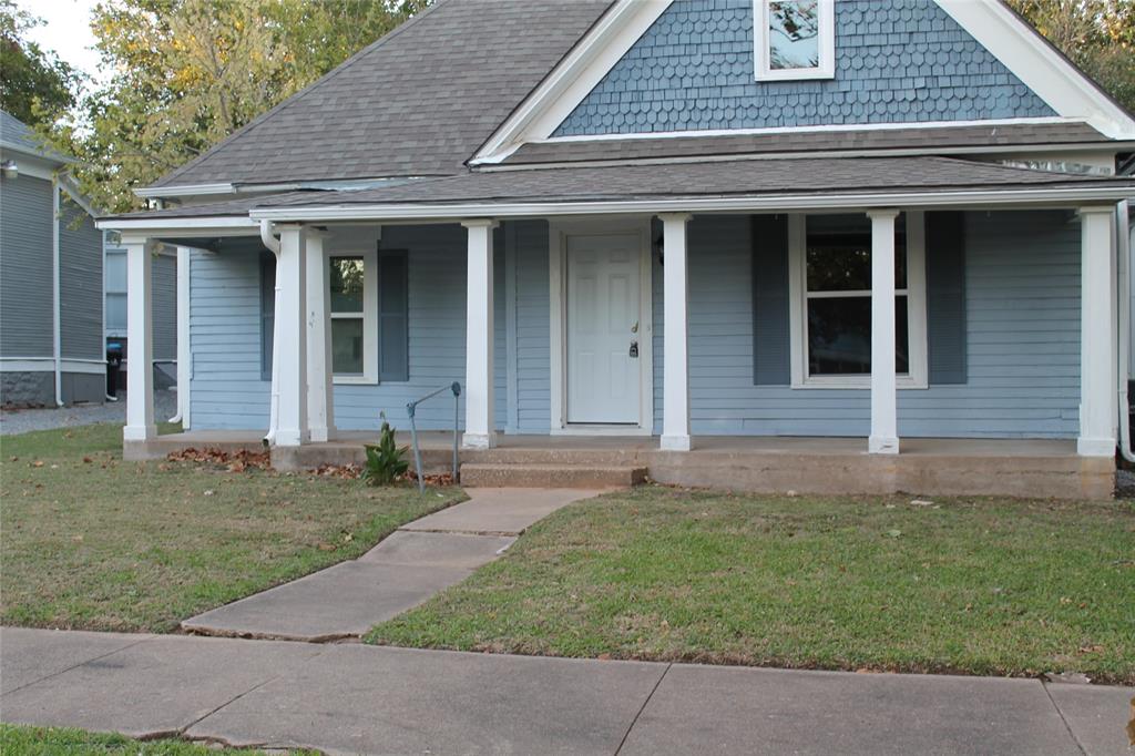 front view of a house with a yard