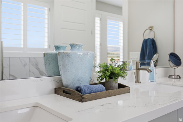21 Pier Place Tooele, UT 84074 - Photo 79 of 112 White countertop with integrated rectangular sink and brushed nickel faucet