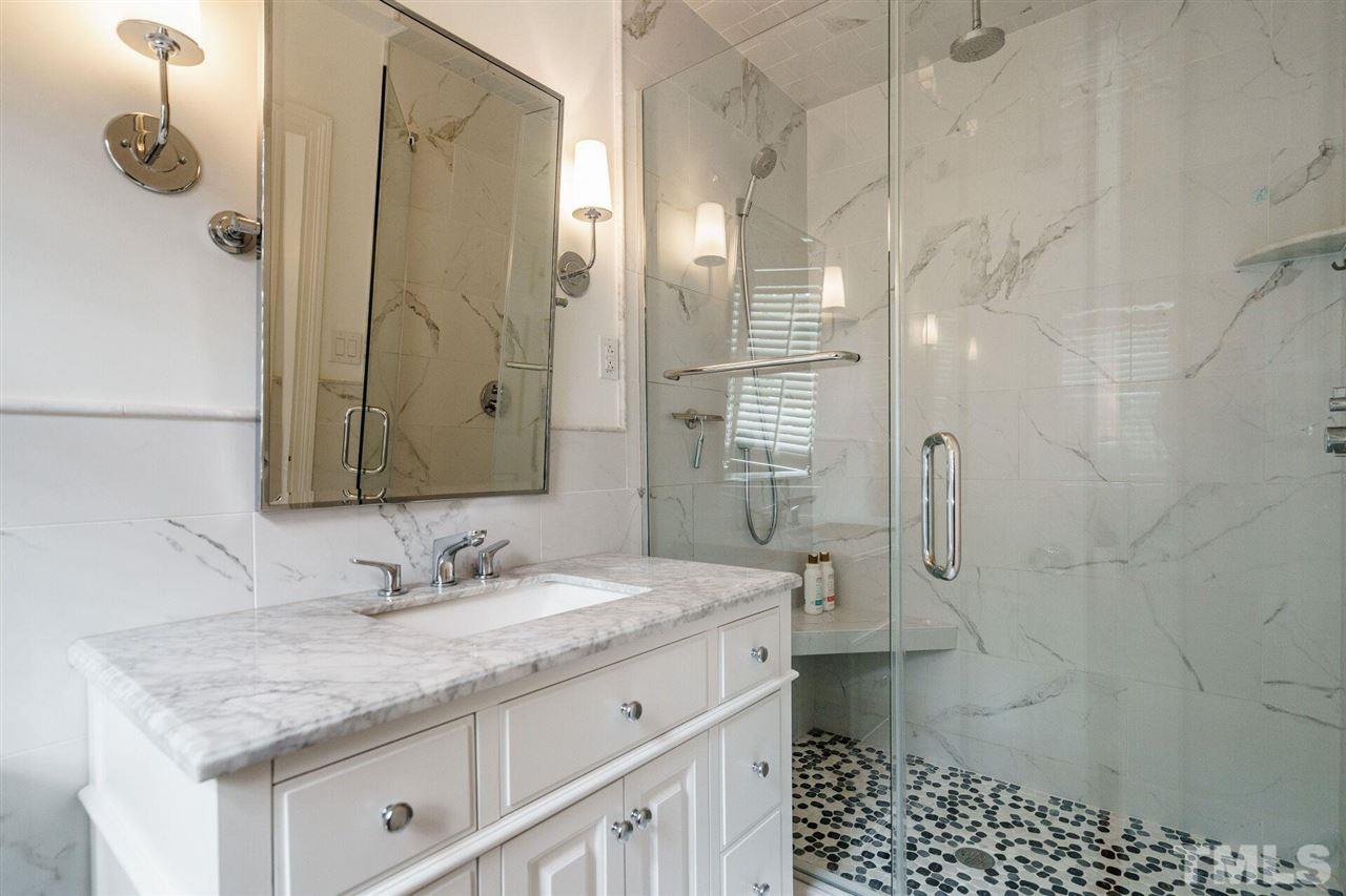 503 Yarmouth Road Raleigh, NC 27608 - Photo 11 of 30 a bathroom with a granite countertop sink a toilet and shower