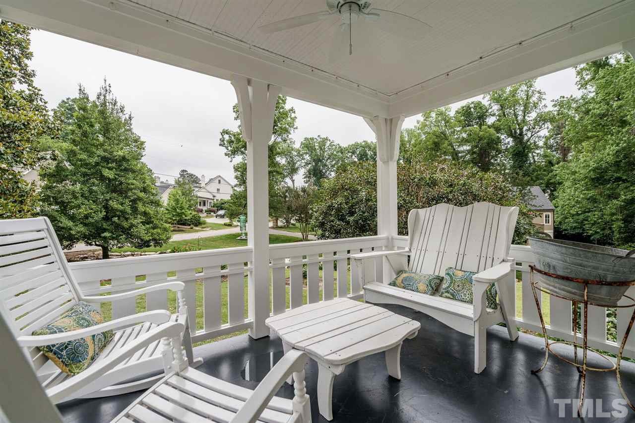 503 Yarmouth Road Raleigh, NC 27608 - Photo 12 of 30 a view of a patio with a table chairs and a grill