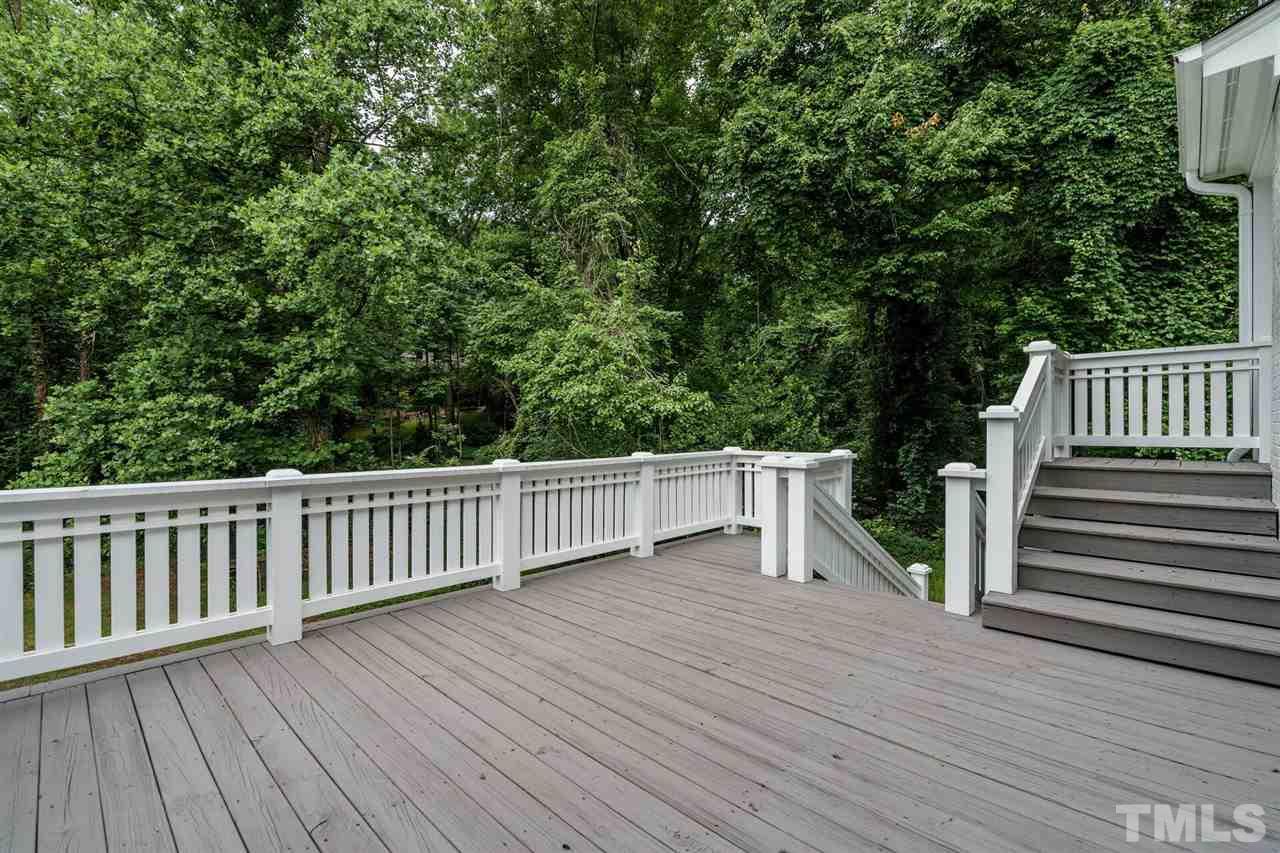 503 Yarmouth Road Raleigh, NC 27608 - Photo 13 of 30 a view of deck with chairs and wooden fence
