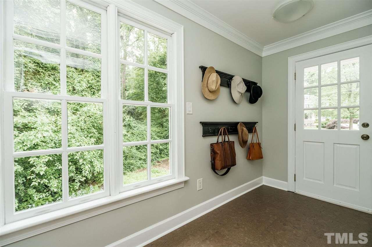 503 Yarmouth Road Raleigh, NC 27608 - Photo 14 of 30 a room with wooden floor and a window