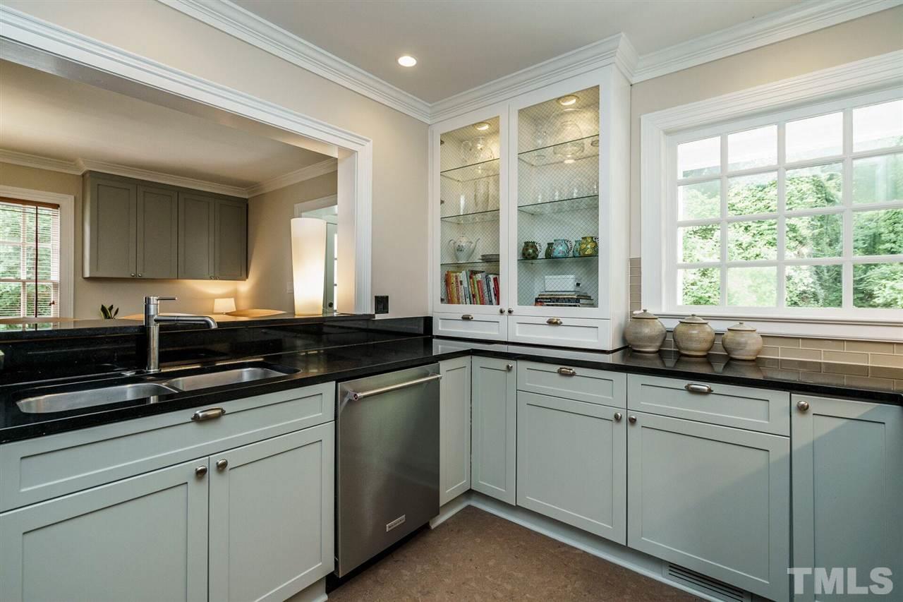 503 Yarmouth Road Raleigh, NC 27608 - Photo 17 of 30 a kitchen with a sink and large window
