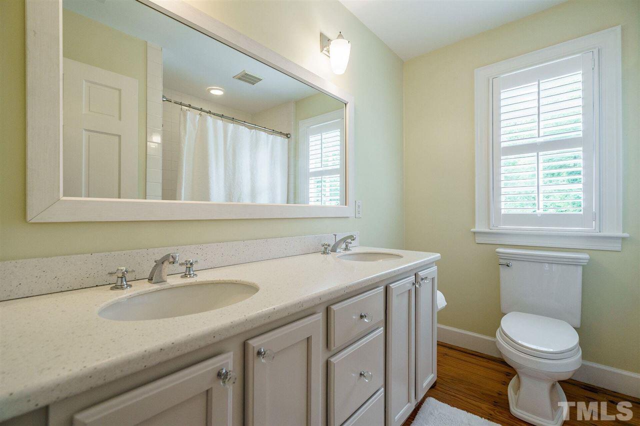 503 Yarmouth Road Raleigh, NC 27608 - Photo 22 of 30 a bathroom with a toilet sink and mirror
