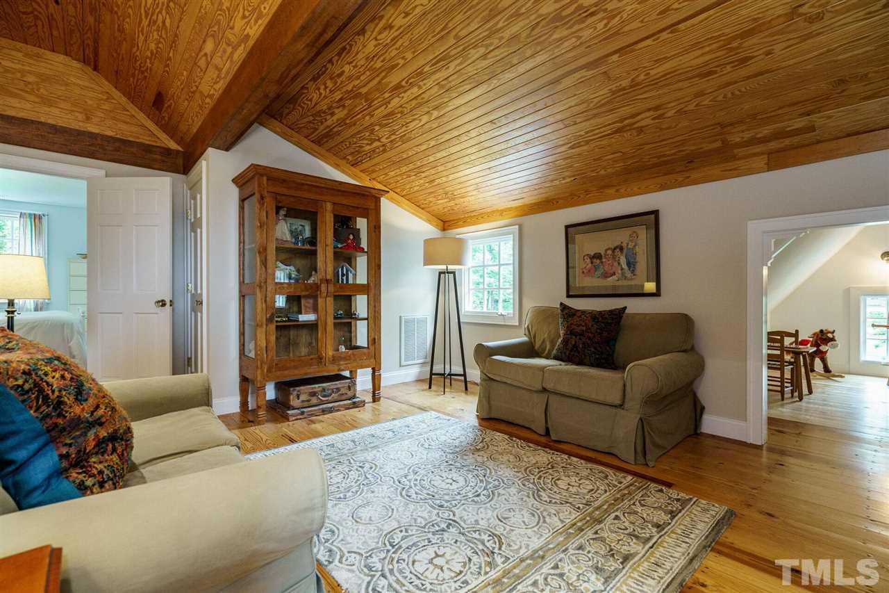 503 Yarmouth Road Raleigh, NC 27608 - Photo 25 of 30 a living room with furniture and wooden floor