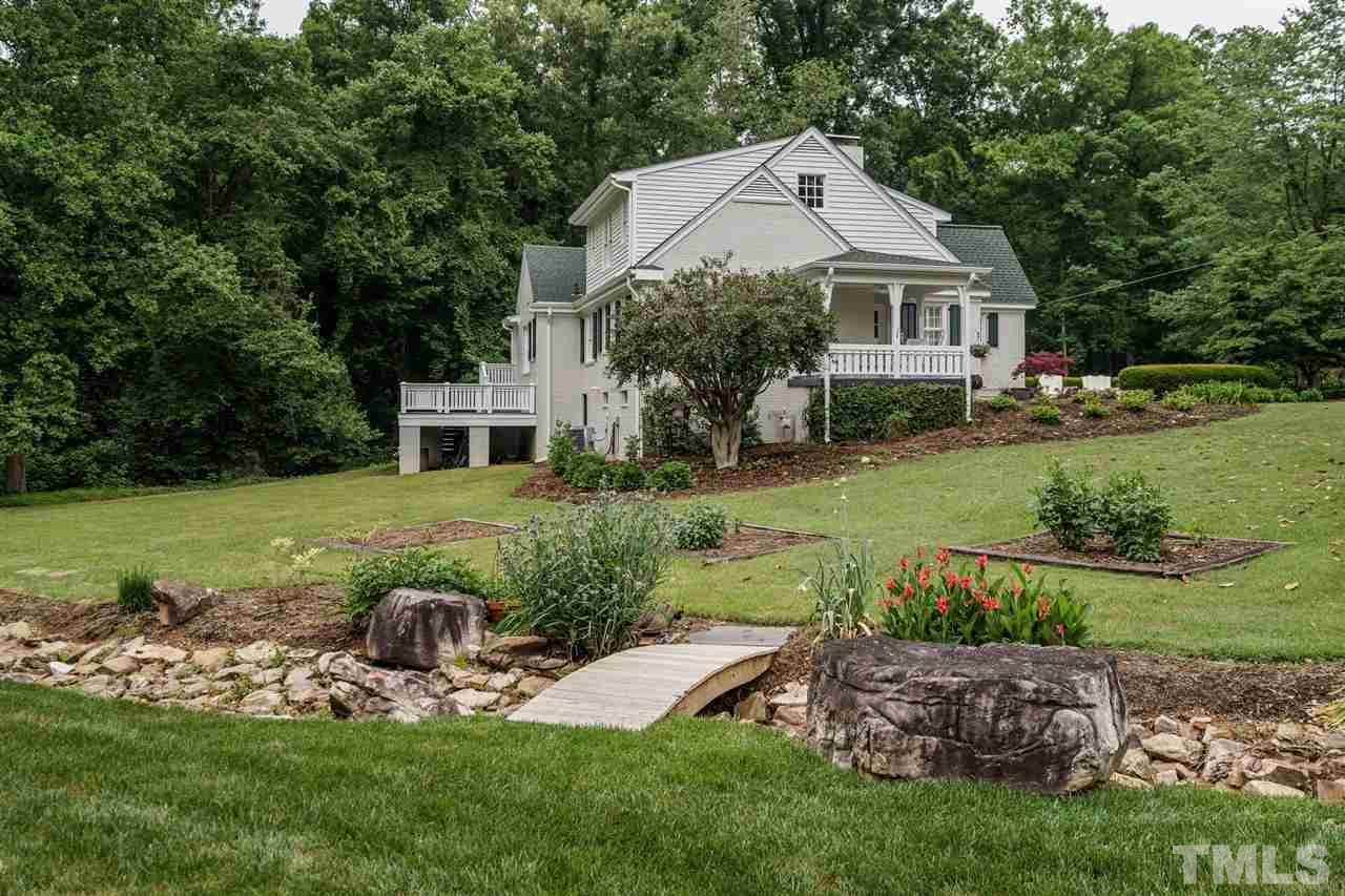 503 Yarmouth Road Raleigh, NC 27608 - Photo 28 of 30 a front view of a house with garden