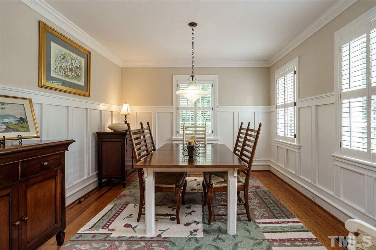 503 Yarmouth Road Raleigh, NC 27608 - Photo 5 of 30 a view of a dining room with furniture window and wooden floor