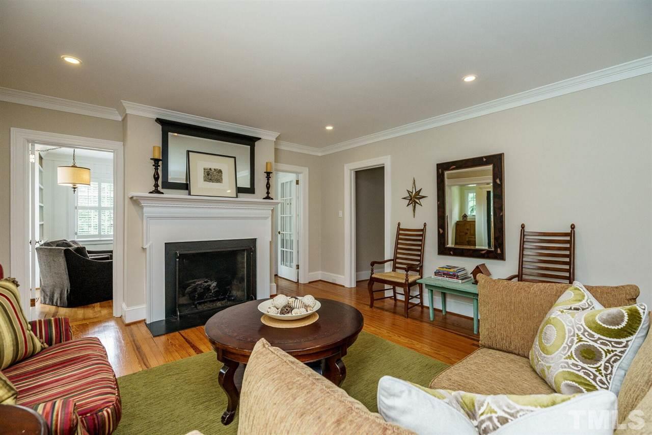 503 Yarmouth Road Raleigh, NC 27608 - Photo 6 of 30 a living room with furniture and a fireplace