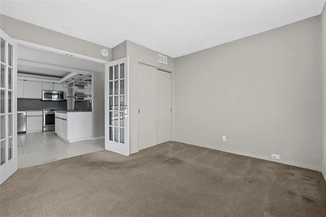 a view of a kitchen with furniture and a kitchen