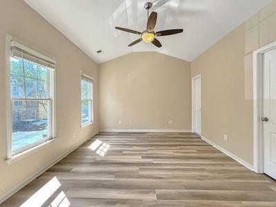 1232 Harris Commons Place, Unit 15 Roswell, GA 30076 - Photo 23 of 36 a view of a livingroom with a ceiling fan and window