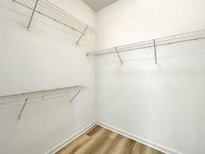 1232 Harris Commons Place, Unit 15 Roswell, GA 30076 - Photo 25 of 36 a view of a room with racks on the wall