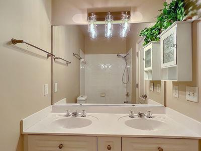 1232 Harris Commons Place, Unit 15 Roswell, GA 30076 - Photo 26 of 36 a bathroom with a sink vanity and a mirror