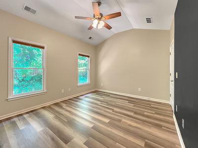 1232 Harris Commons Place, Unit 15 Roswell, GA 30076 - Photo 29 of 36 wooden floor in an empty room with a window