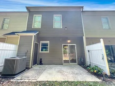 a view of a brick house with many windows