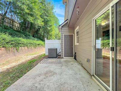 1232 Harris Commons Place, Unit 15 Roswell, GA 30076 - Photo 34 of 36 a view of a house with backyard and garden
