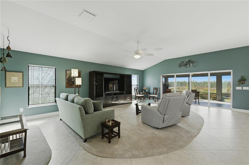 1016 Pickering Path The Villages, FL 32163 - Photo 11 of 38 a living room with furniture and a fireplace