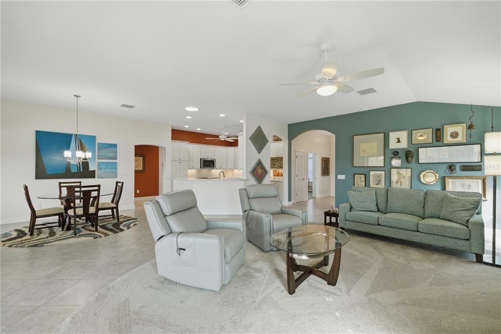 1016 Pickering Path The Villages, FL 32163 - Photo 13 of 38 a living room with furniture and a large window