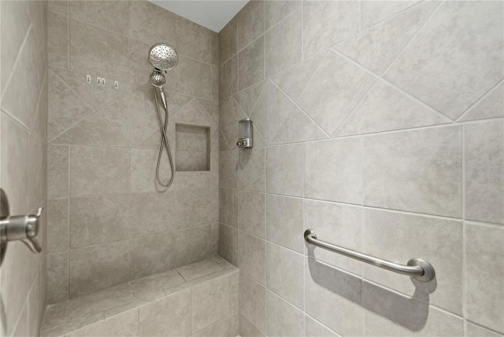 1016 Pickering Path The Villages, FL 32163 - Photo 22 of 38 a bathroom with a shower