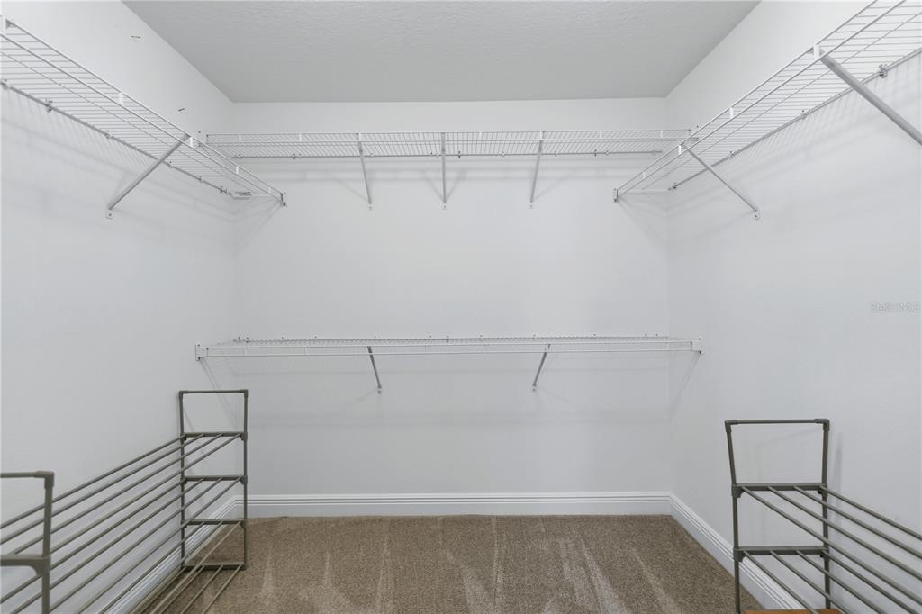 1016 Pickering Path The Villages, FL 32163 - Photo 24 of 38 a view of a room with racks on the wall