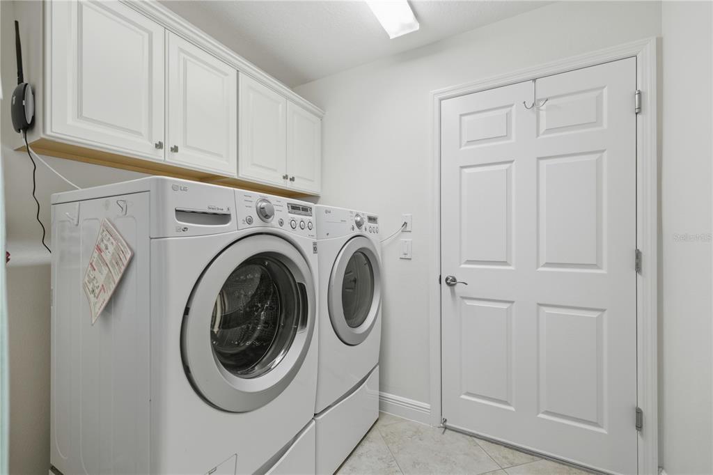 1016 Pickering Path The Villages, FL 32163 - Photo 25 of 38 a utility room with dryer and washer