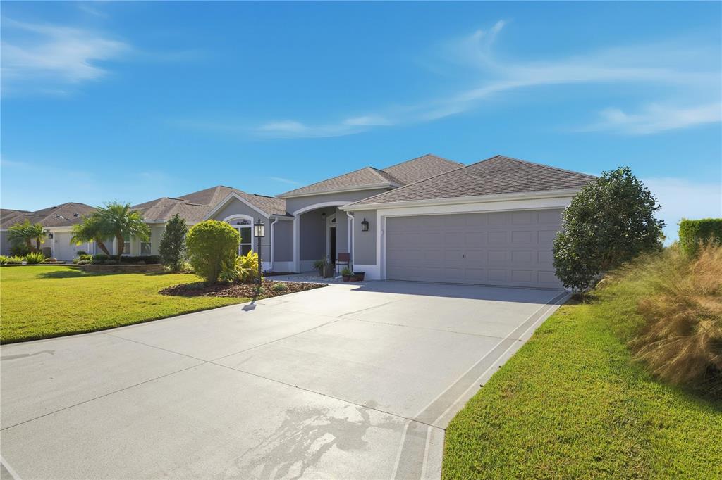 1016 Pickering Path The Villages, FL 32163 - Photo 31 of 38 a front view of a house with yard and green space