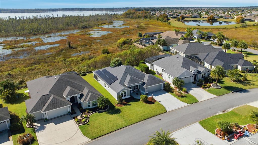 1016 Pickering Path The Villages, FL 32163 - Photo 35 of 38 an aerial view of residential houses with outdoor space and ocean view