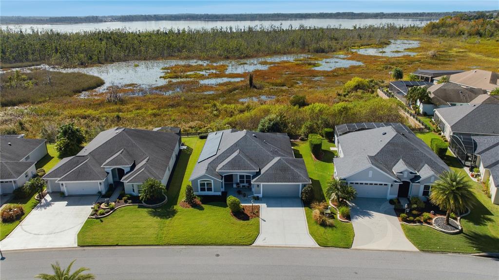 1016 Pickering Path The Villages, FL 32163 - Photo 36 of 38 an aerial view of residential houses with outdoor space
