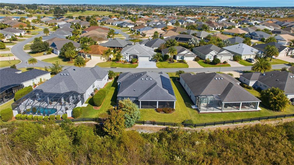 1016 Pickering Path The Villages, FL 32163 - Photo 38 of 38 an aerial view of residential houses with outdoor space and swimming pool