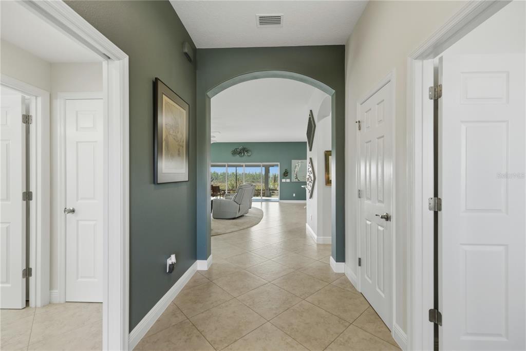 1016 Pickering Path The Villages, FL 32163 - Photo 4 of 38 a view of a hallway with living room and glass door