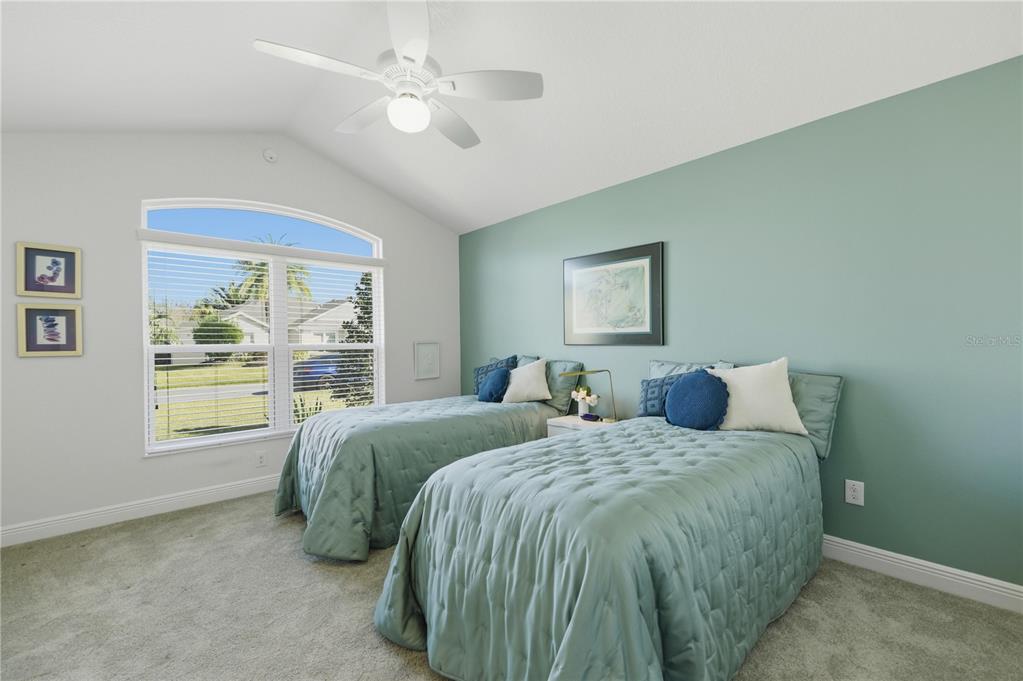 1016 Pickering Path The Villages, FL 32163 - Photo 5 of 38 a bed sitting in a bedroom next to a window