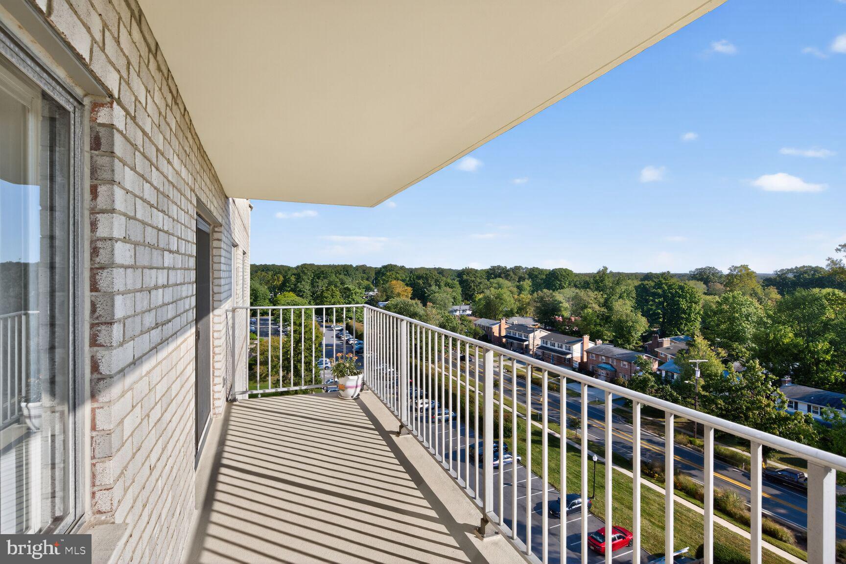1111 University Boulevard West, Unit 1016 & 1017 Silver Spring, MD 20902 - Photo 1 of 38 a view of a balcony with wooden floor and fence
