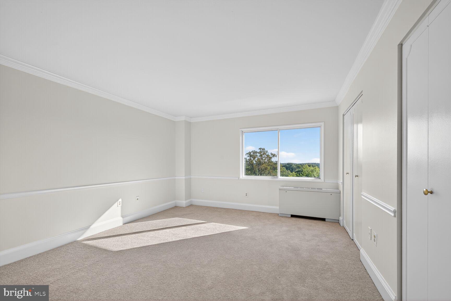 1111 University Boulevard West, Unit 1016 & 1017 Silver Spring, MD 20902 - Photo 13 of 38 an empty room with windows