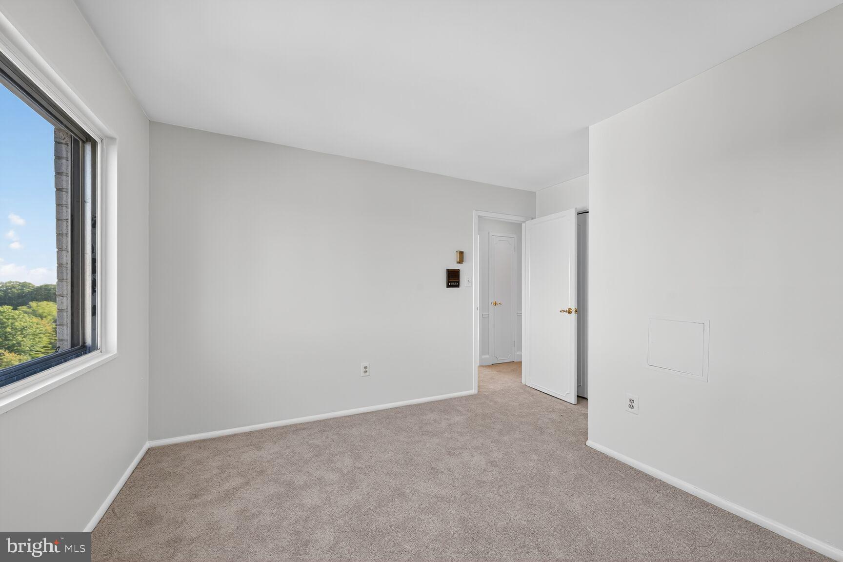 1111 University Boulevard West, Unit 1016 & 1017 Silver Spring, MD 20902 - Photo 18 of 38 a view of an empty room with a window