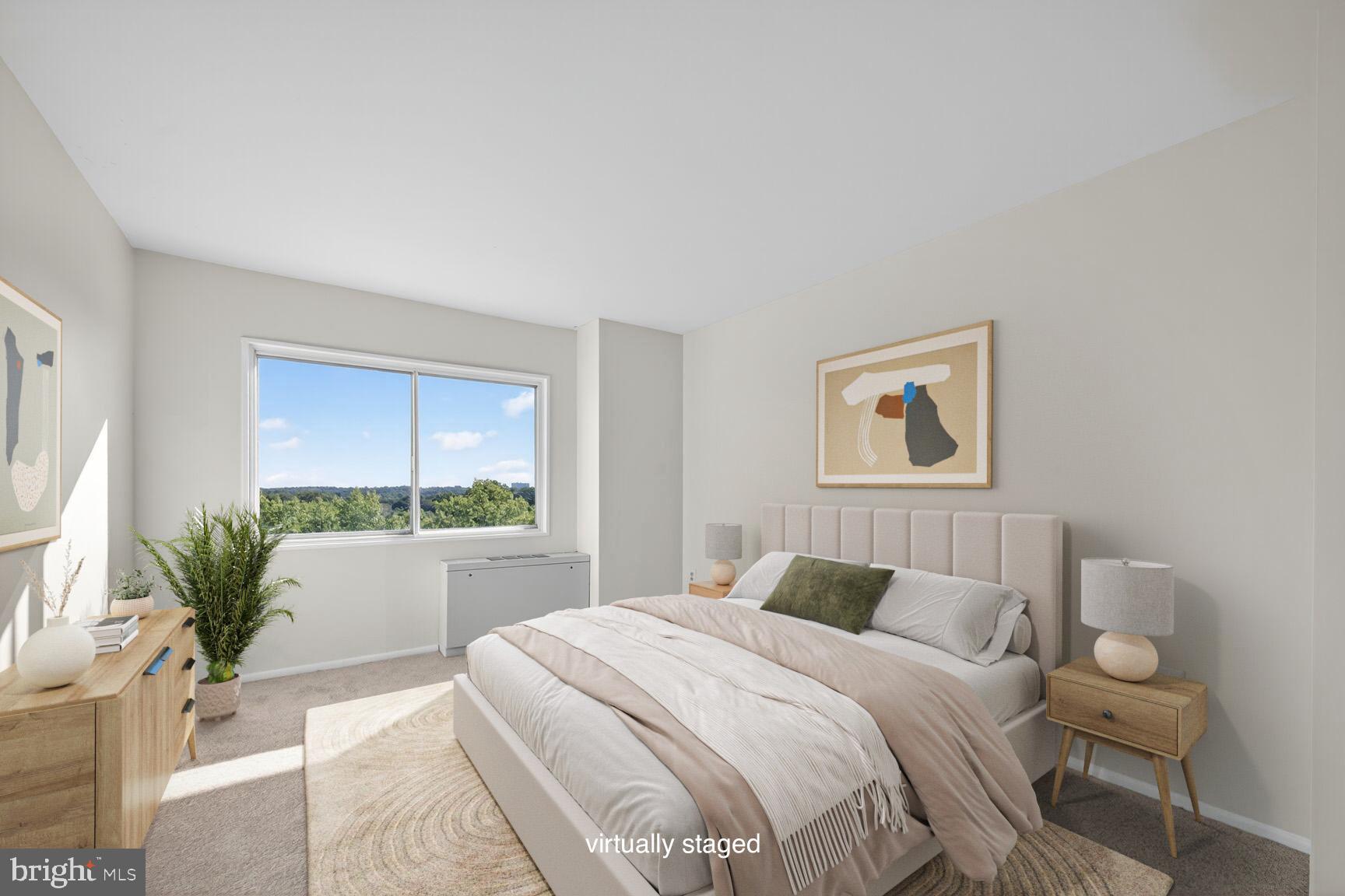1111 University Boulevard West, Unit 1016 & 1017 Silver Spring, MD 20902 - Photo 21 of 38 a bedroom with a large bed and a potted plant