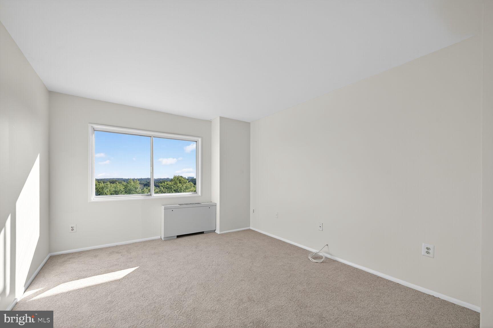 1111 University Boulevard West, Unit 1016 & 1017 Silver Spring, MD 20902 - Photo 22 of 38 an empty room with windows