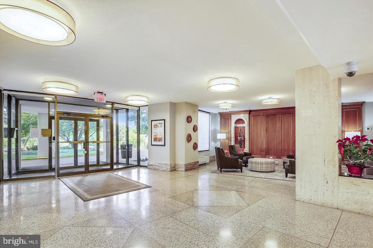 1111 University Boulevard West, Unit 1016 & 1017 Silver Spring, MD 20902 - Photo 28 of 38 a lobby with furniture and floor to ceiling window