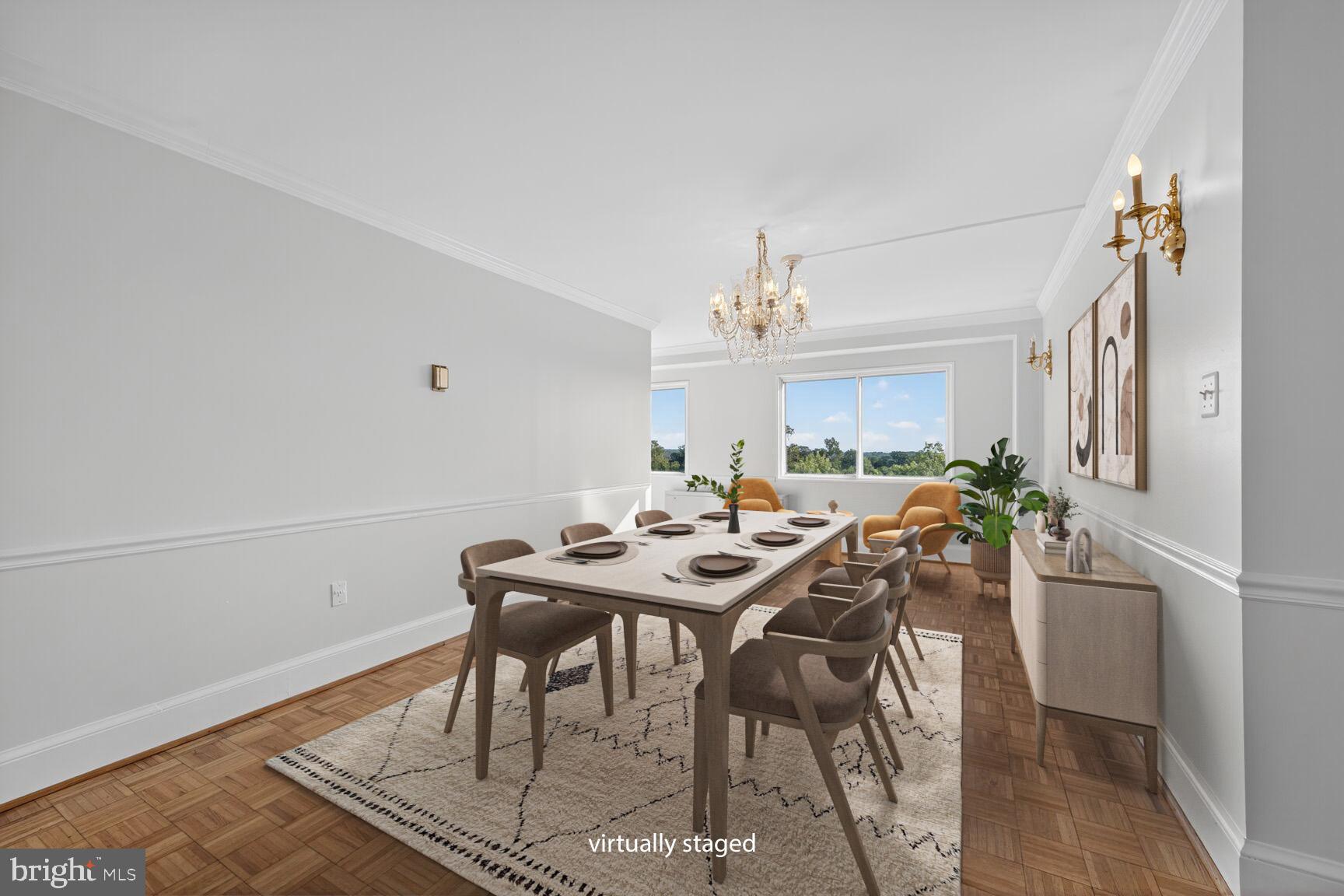 1111 University Boulevard West, Unit 1016 & 1017 Silver Spring, MD 20902 - Photo 6 of 38 a view of a dining room with furniture and a chandelier