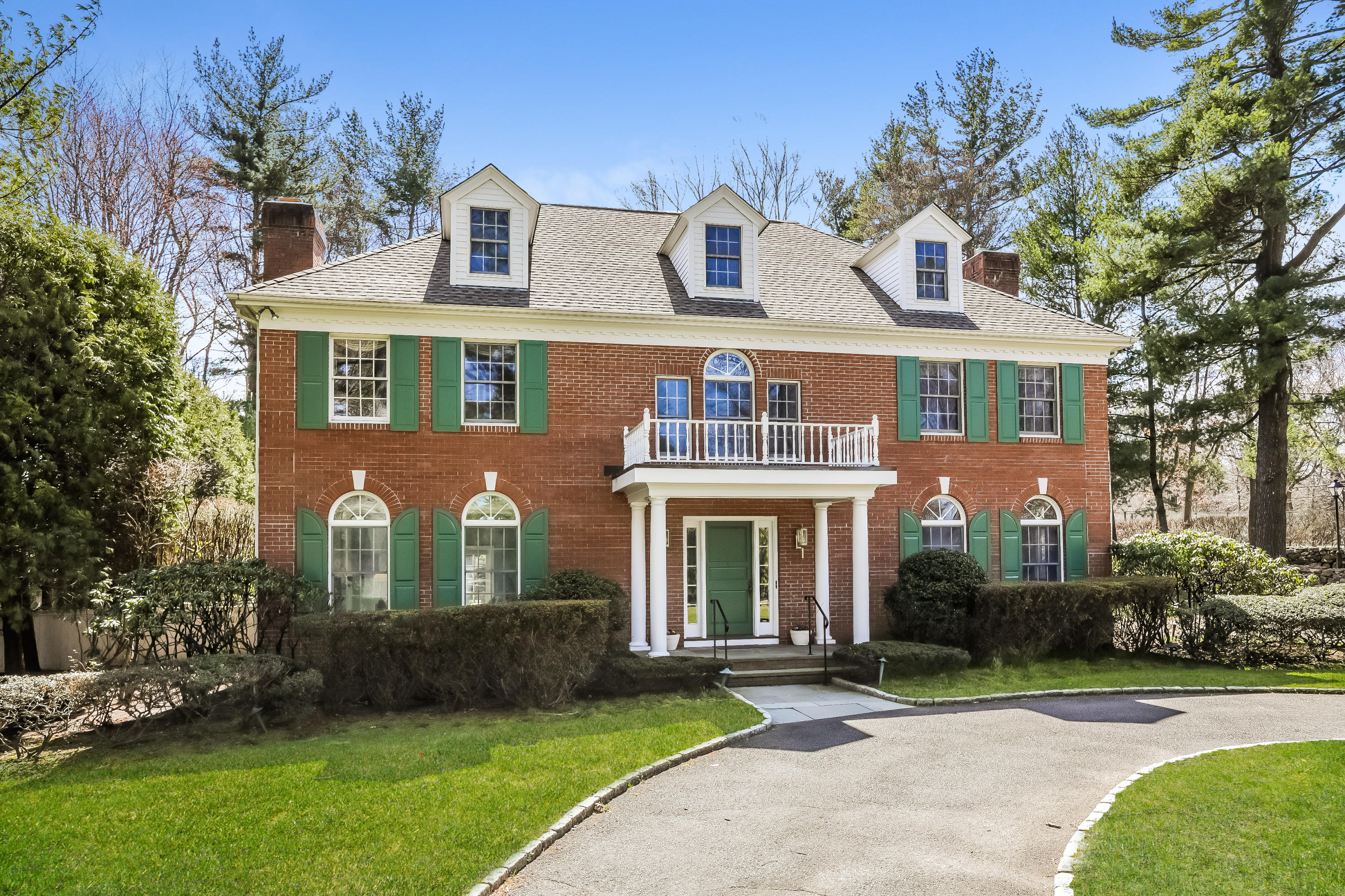 1 Shields Lane Darien, CT 06820 - Photo 2 of 41 a front view of a house with a yard and trees