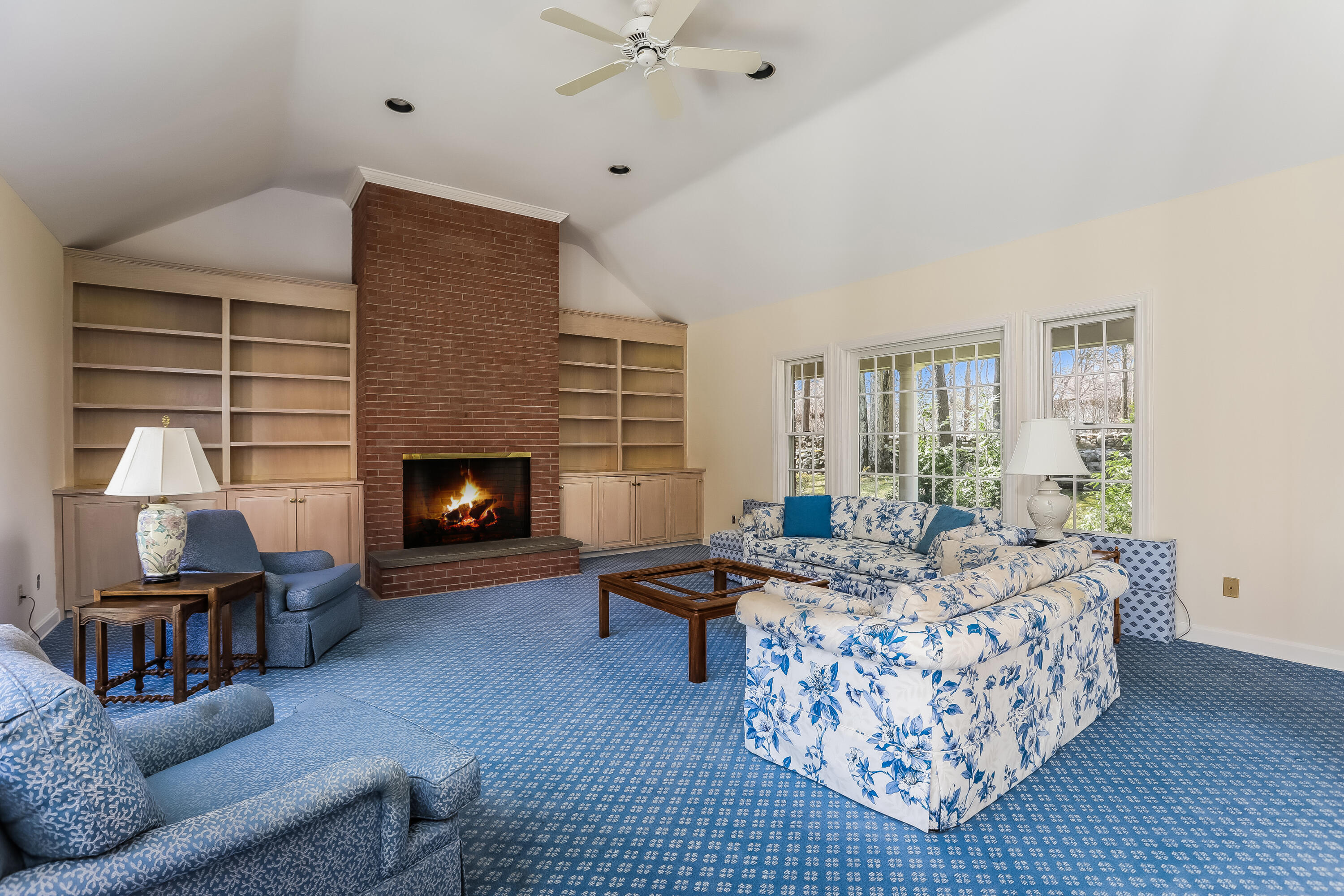 1 Shields Lane Darien, CT 06820 - Photo 15 of 41 a living room with furniture and a fireplace