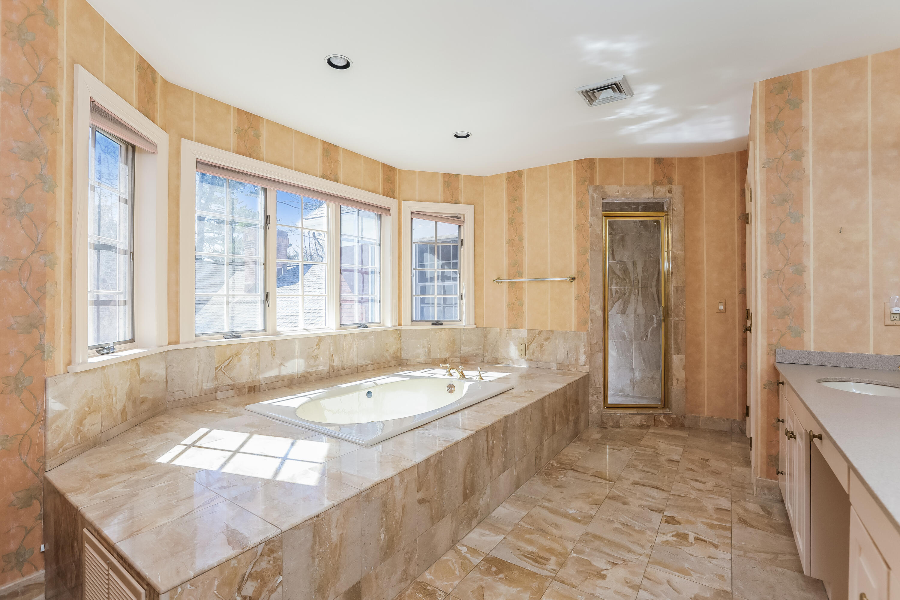 1 Shields Lane Darien, CT 06820 - Photo 21 of 41 a spacious bathroom with a tub a sink and a large mirror